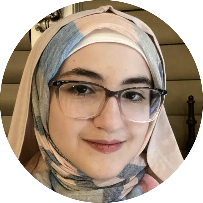 A girl with a hijab and glasses.